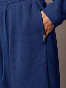 Quần thể thao ống rộng SUMWON, kiểu dáng thoải mái, chất liệu nỉ, có dây rút ở eo và túi bên hông, thích hợp cho mùa thu đông. - Màu xanh lam - Xem 7