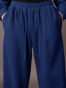 Quần thể thao ống rộng SUMWON, kiểu dáng thoải mái, chất liệu nỉ, có dây rút ở eo và túi bên hông, thích hợp cho mùa thu đông. - Màu xanh lam - Xem 6