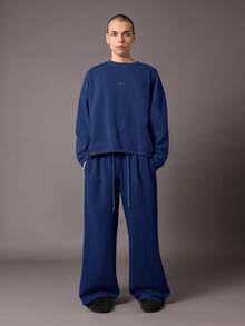 Quần thể thao ống rộng SUMWON, kiểu dáng thoải mái, chất liệu nỉ, có dây rút ở eo và túi bên hông, thích hợp cho mùa thu đông. - Màu xanh lam - Xem 3