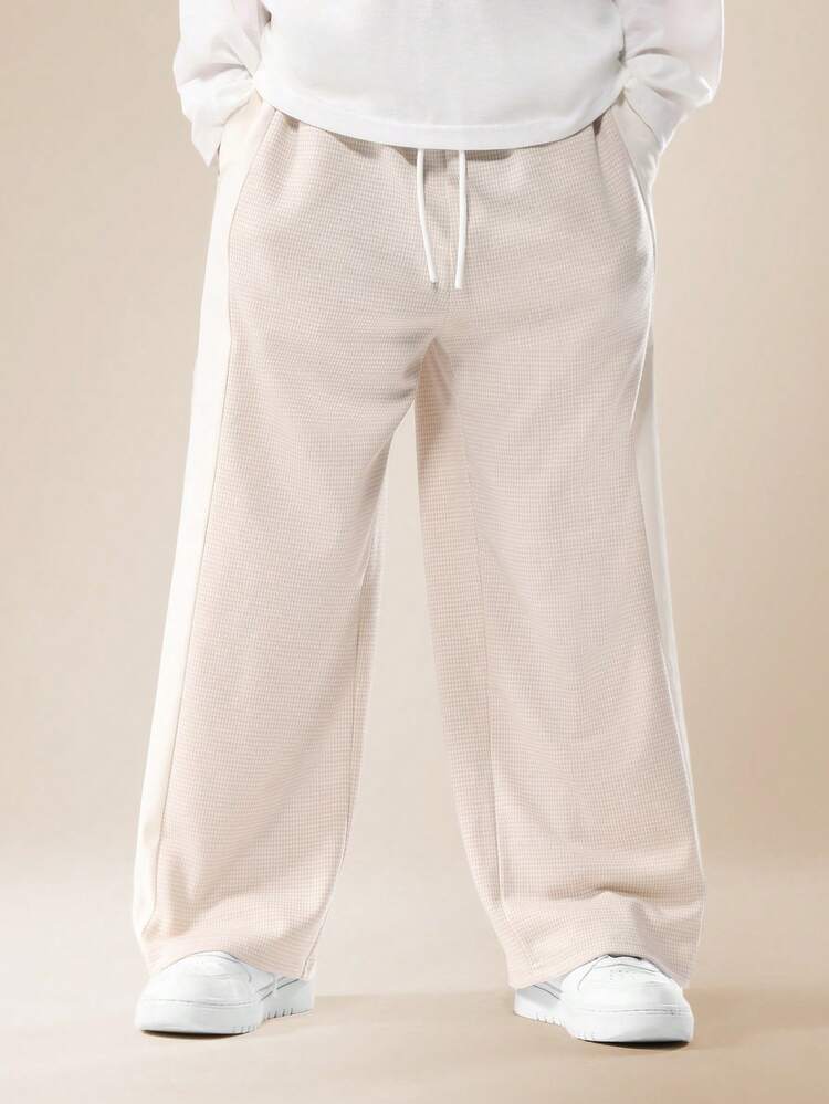 Pantaloni larghi con trama pied de poule
