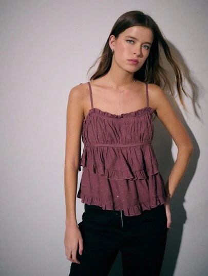 Nöista Burgundy Sleeveless Ruffled Layered Top With Tie Straps And Subtle Dotted Pattern; A Romantic Ruffle Top Perfect For Summer Party Wear, Date Outfits And Chic Casual Looks; Adaptable For Fall And Winter Layering And Suitable For Halloween And New Year Styling.