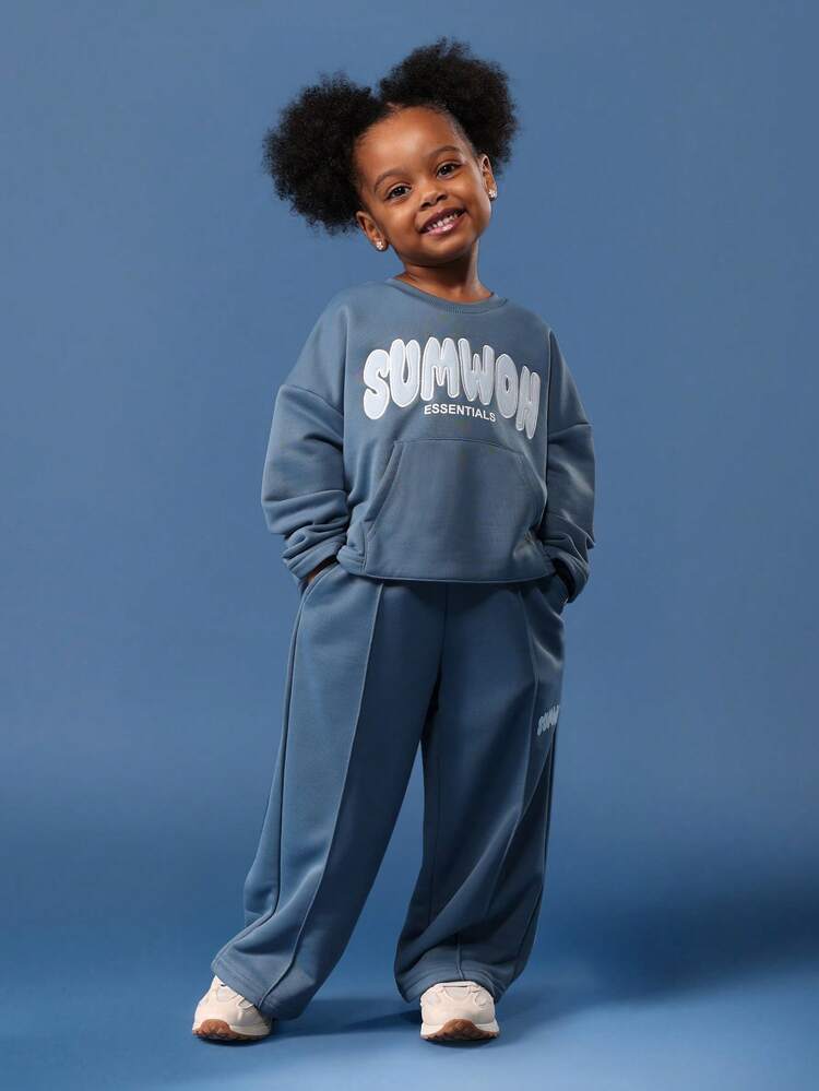 Bluza z okrągłym dekoltem, kieszenią pośrodku i szerokimi nogawkami