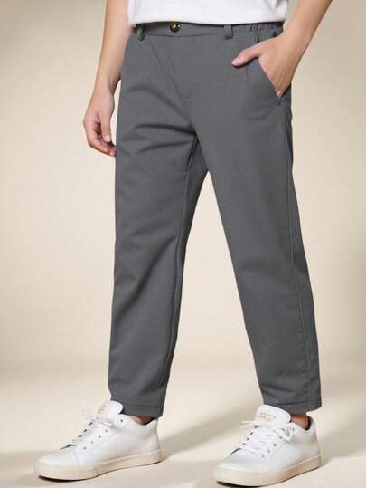 SHEIN Pantalones casuales y cómodos de unicolor para niños pequeños - Con un solo botón decorativo, bolsillos en diagonal, diseño de cintura elástica, aptos para uso diario, viajes, fiestas y festivales, versátiles y de moda