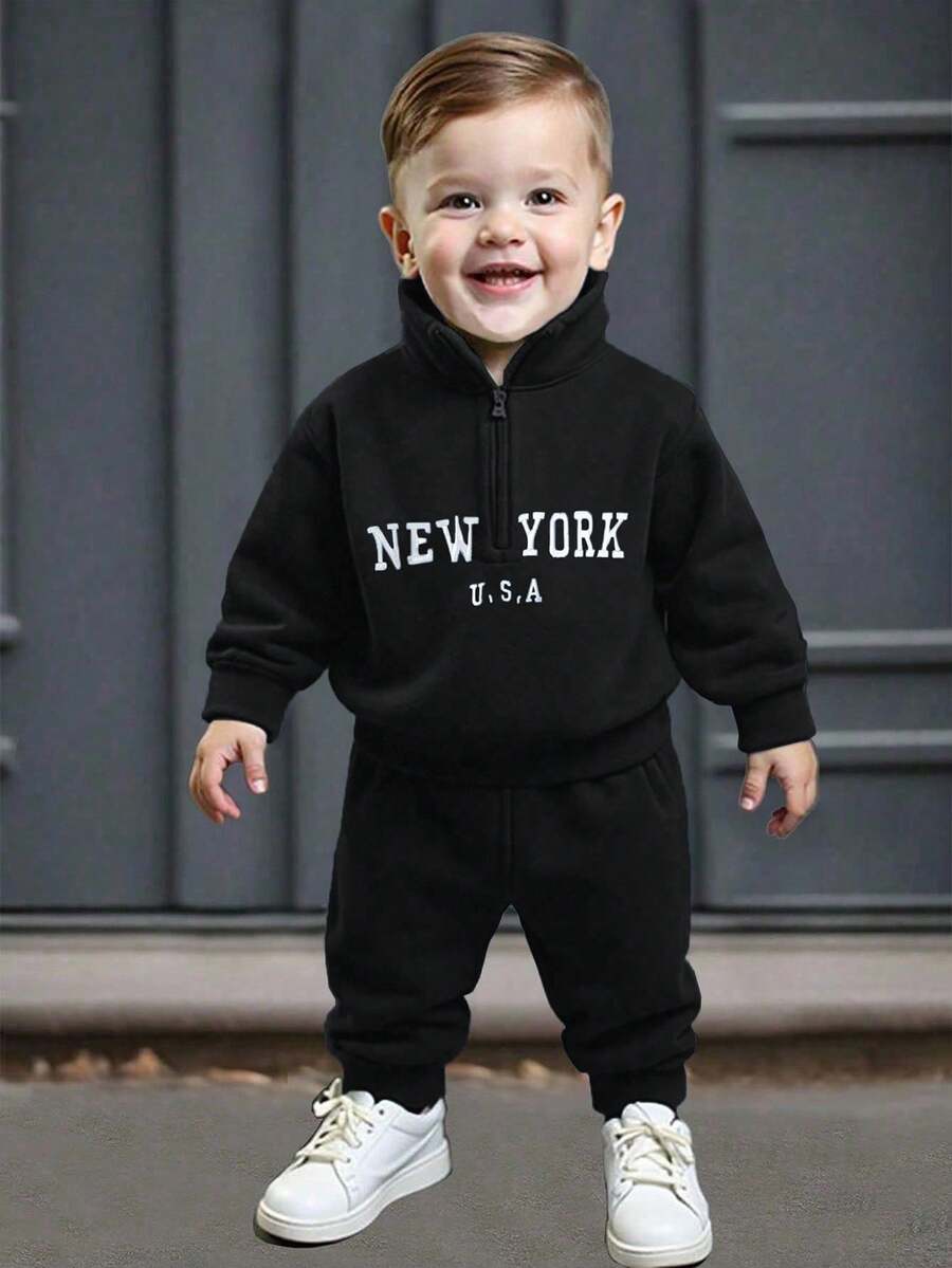 SHEIN Playful Pals 春秋宝宝必备！清新纯净的风格，厚实却不失轻盈。纯色半拉链长袖上衣，刺绣字母装饰，彰显个性与俏皮；搭配纯色无腰长裤，简约又不失时尚。 - 黑色 - 查看 1