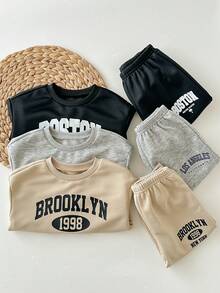 SHEIN 6 Stücke/Set Baby Mädchen süßer Buchstaben-Muster Langarm Sweatshirt & Hose mit elastischem Bund, Herbst/Winter