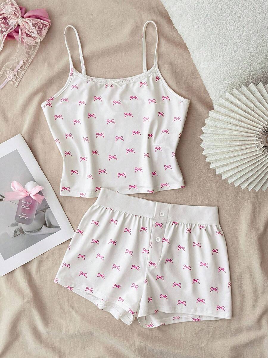 少女春夏情人节家居服，清新少女风/美式风格，蕾丝蝴蝶结白色吊带背心和超短裤纽扣套装，女童睡衣套装，女童夏季睡衣套装，少女睡衣套装，可爱睡衣套装，蝴蝶结睡衣套装，女童夏季睡衣睡衣套装，吊带蝴蝶结两件套，女童夏季套装，可爱睡衣套装，蝴蝶结印花两件套 - 粉色 - 查看 1
