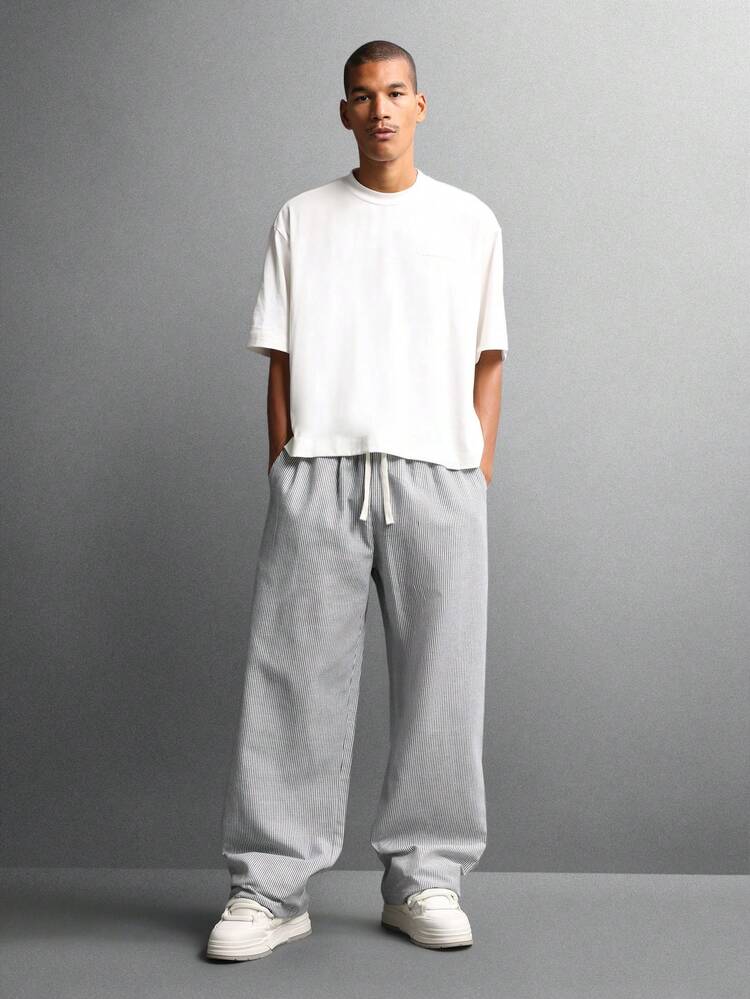 Spodnie z szerokimi nogawkami i prążkami oraz elastyczną talią