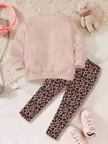 SHEIN Bộ đồ Happikins 2 món cho bé gái, gồm áo nỉ dài tay cổ tròn dáng rộng thoải mái và quần legging, màu kem Ireland, họa tiết da báo ngọt ngào với nơ lấp lánh, thích hợp cho mùa thu đông. - Nhiều màu - Xem 2