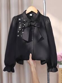 Sparklyn 女童衬衫，泡泡长袖，肩部珍珠装饰，可拆卸蝴蝶结装饰，宽松版型，活力风格，舒适面料，适合与背带裙搭配或作为内衣，春秋季 - 黑色 - 查看 1