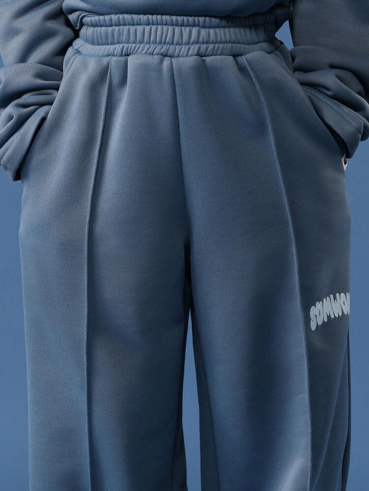 Bluza z okrągłym dekoltem, kieszenią pośrodku i szerokimi nogawkami