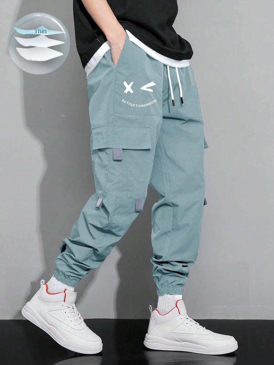 Claim Dot Loose Fit Men's Cartoon Printed Flap Pocket Cargo Pants - Baby Blue - View 1