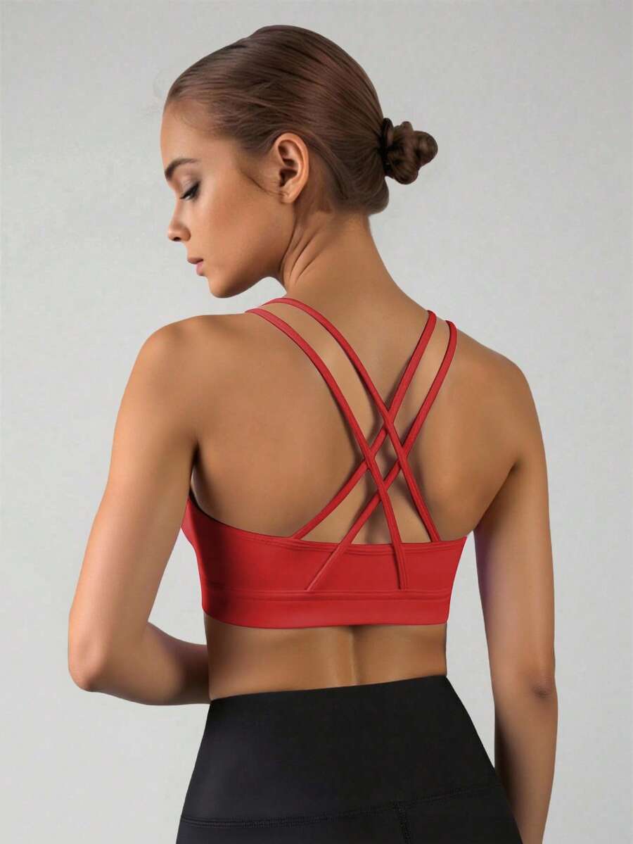 SHEIN Áo bra thể thao thấm hút mồ hôi dành cho bé gái tuổi teen, có đệm mút tháo rời, dây đeo chéo lưng, phù hợp cho yoga và các hoạt động thể thao. - Đỏ - Xem 1