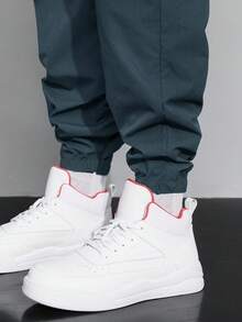 Claim Dot 秋季宽松男士卡通印花翻盖口袋裤