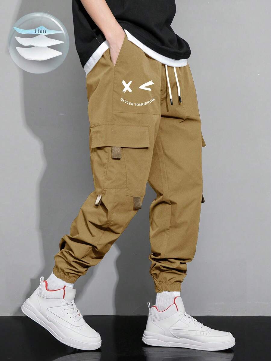 Claim Dot 男士表情印花翻盖口袋抽绳腰工装裤，适合秋季 - 駝色 - 查看 1