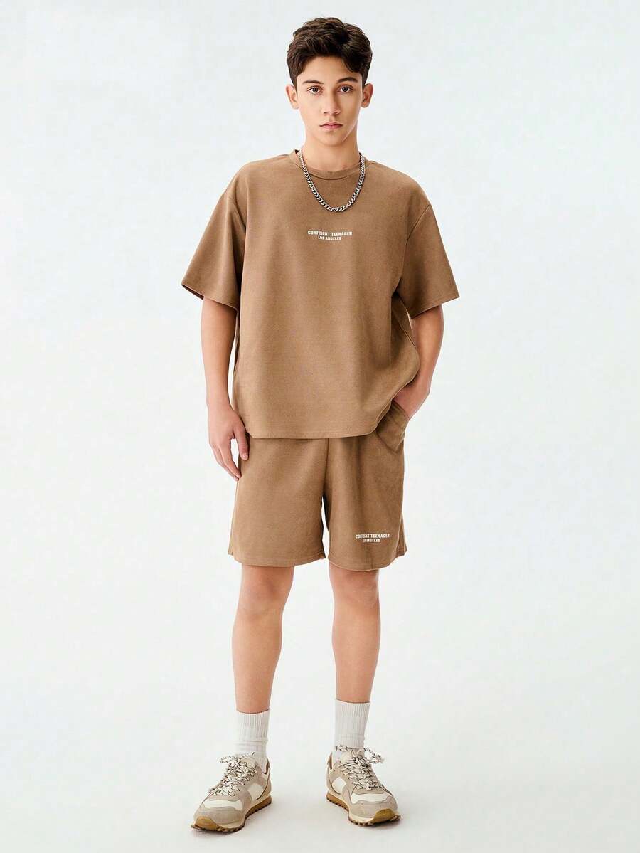 SHEIN 2pcs/Set American Hip Hop Style Clean Graphic Letter Print Teenager Short Sleeve T-Shirt + Casual Letter Print Sports Shorts, Suitable For Streetwear, Jogging, Skateboarding, Outdoor Activities