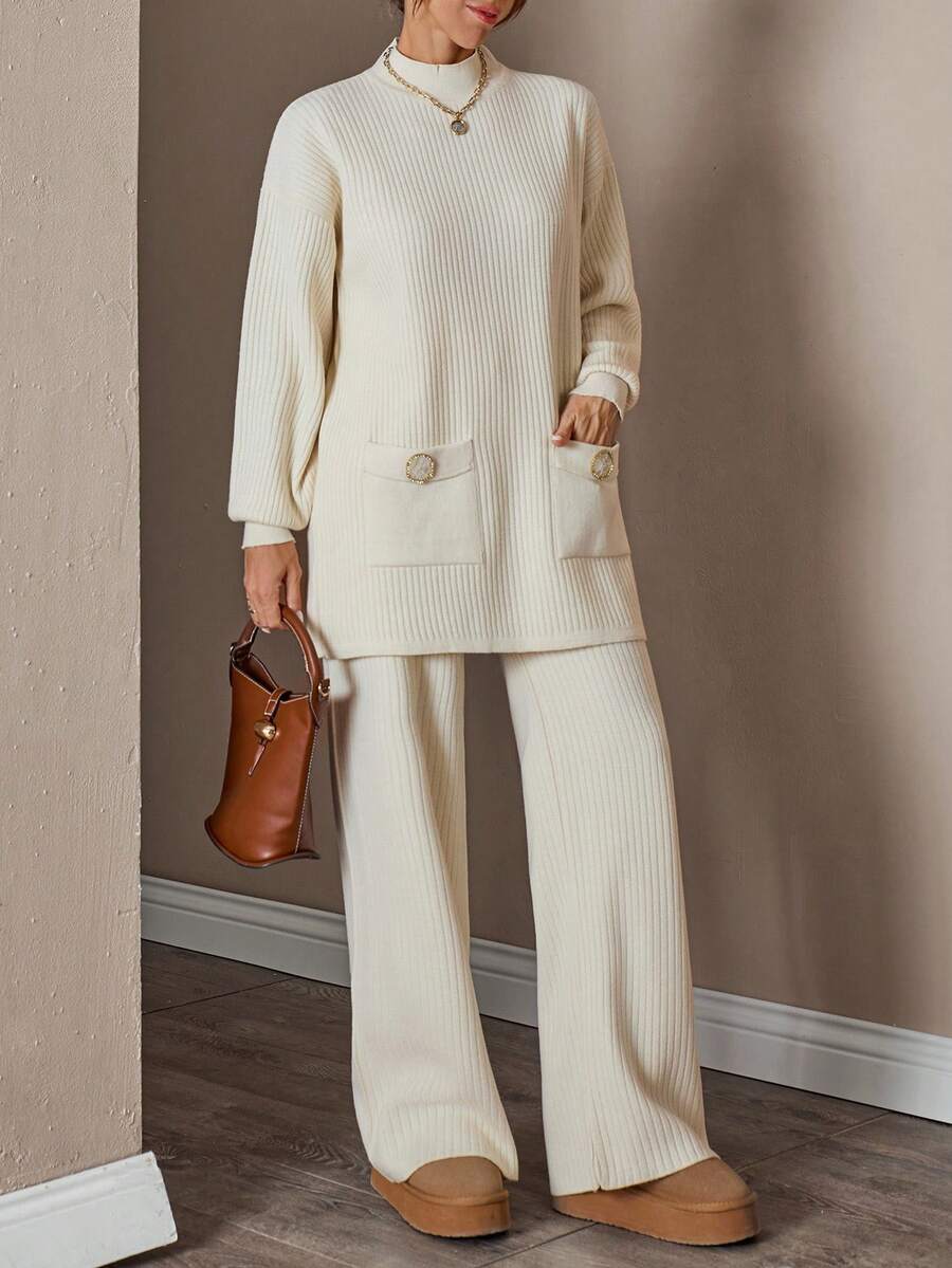 Completo donna con top a collo alto a maniche lunghe e pantaloni, tinta unita