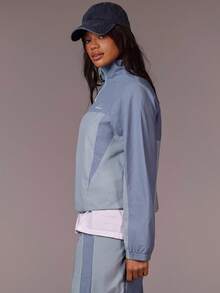 Athîral Women's Light Slate Blue Half-Zip Windbreaker Jacket | Soft Relaxed Fit Sport Outerwear With Stand Collar & Long Raglan Sleeves For Effortless Minimalist Activewear (Running/Travel/Lounge)Windbreaker Jacket, Half Zip, Light Blue Fashion, Soft Sport Outerwear, Minimalist Athleisure, Relaxed Fit Jacket, Effortless Street Style, Sporty Lounge - Blue - View 5