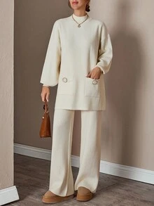 Completo donna con top a collo alto a maniche lunghe e pantaloni, tinta unita