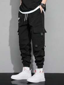 Claim Dot 宽松男士表情印花翻盖口袋抽绳腰工装裤，秋季 - 黑色 - 查看 7