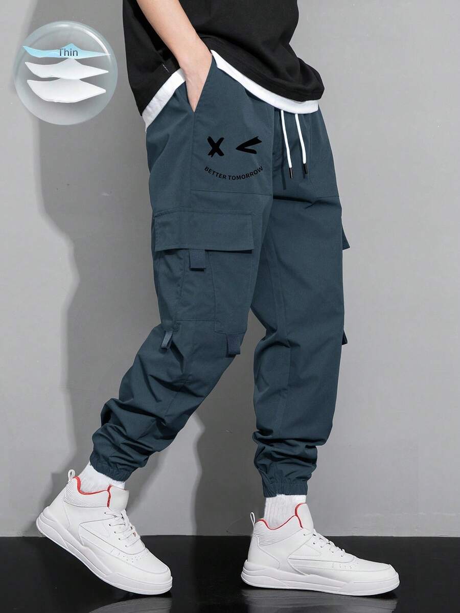 Claim Dot 秋季宽松男士卡通印花翻盖口袋裤