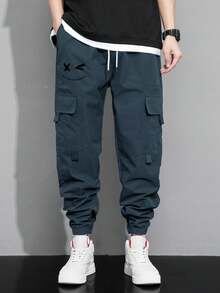 Claim Dot 秋季宽松男士卡通印花翻盖口袋裤