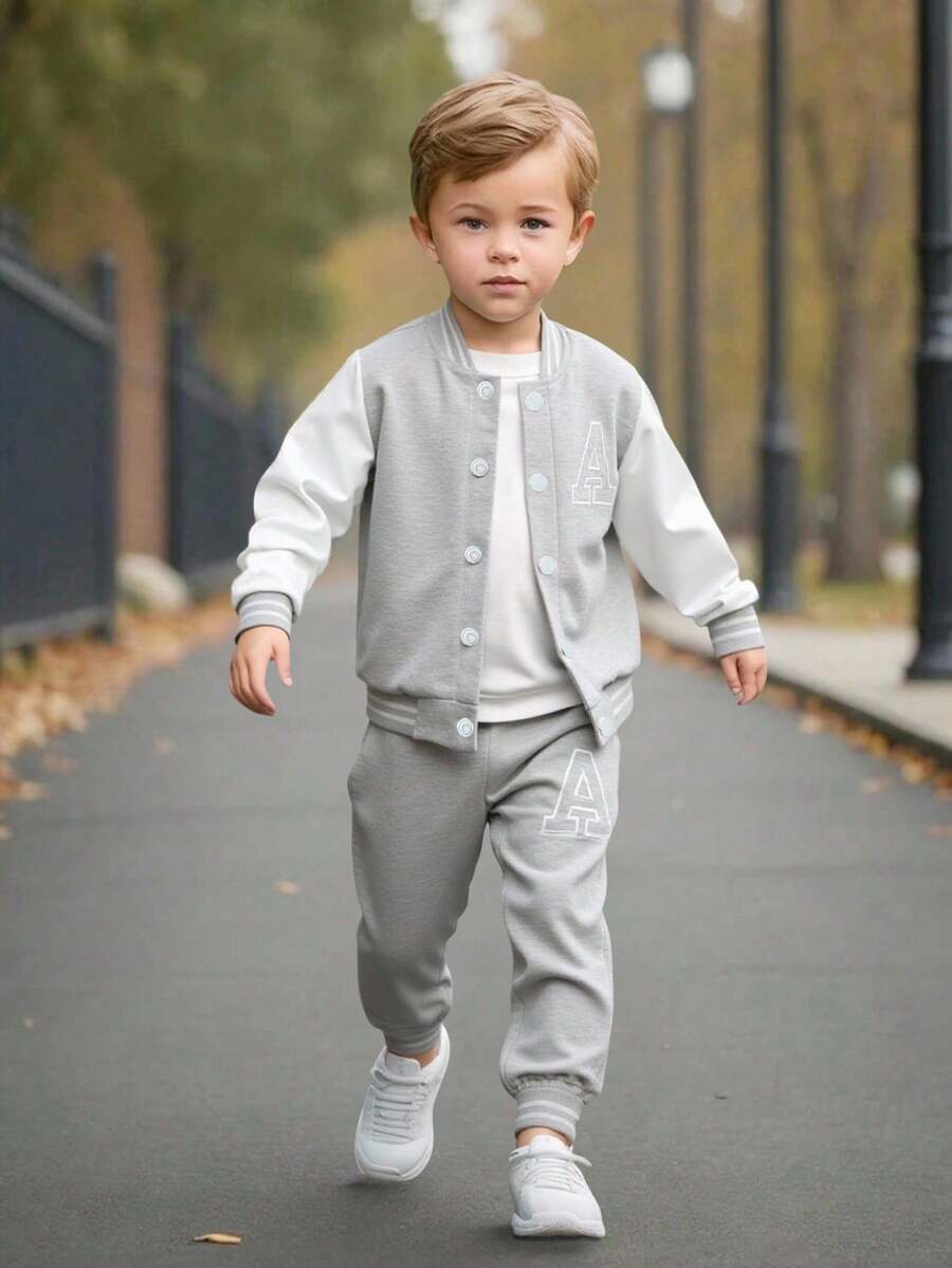 SHEIN Explorewe Bộ 2 món cho bé trai - Áo len dệt kim màu đen có tay áo màu trắng và in chữ "A" ở phía trước, kết hợp với quần nỉ in họa tiết phù hợp. Cổ áo, tay áo và gấu áo có gân tạo sự thoải mái. Thường ngày, thể thao, phù hợp mặc hàng ngày vào mùa xuân/thu, đi học, du lịch - Nhiều màu - Xem 1