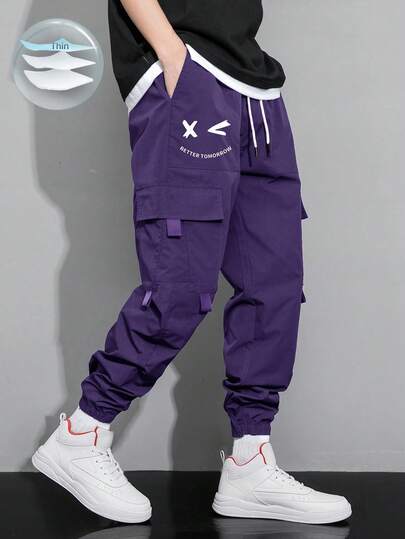 Manfinity EMRG Pantalones cargo holgados con cintura con cordón, bolsillo con solapa y estampado de dibujos animados para hombre, otoño