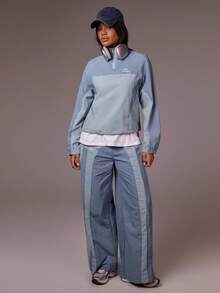 Athîral Women's Light Slate Blue Half-Zip Windbreaker Jacket | Soft Relaxed Fit Sport Outerwear With Stand Collar & Long Raglan Sleeves For Effortless Minimalist Activewear (Running/Travel/Lounge)Windbreaker Jacket, Half Zip, Light Blue Fashion, Soft Sport Outerwear, Minimalist Athleisure, Relaxed Fit Jacket, Effortless Street Style, Sporty Lounge - Blue - View 1