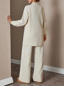 Completo donna con top a collo alto a maniche lunghe e pantaloni, tinta unita