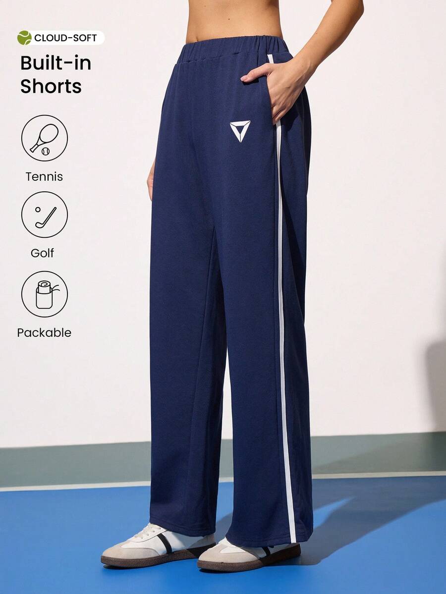 CourtClass Sweat-shirt-shirt décontracté pour femmes avec rayures latérales contrastées, pantalon de sport ample avec poches, convient pour le sport, le tennis, le port quotidien. Pantalon de tennis, pantalon de gym, pantalon de sport, pantalon de golf, pantalon de jogging, pantalon de jogging à jambes larges, pantalon d'athlétisme pour femmes - Bleu marine - Voir 1
