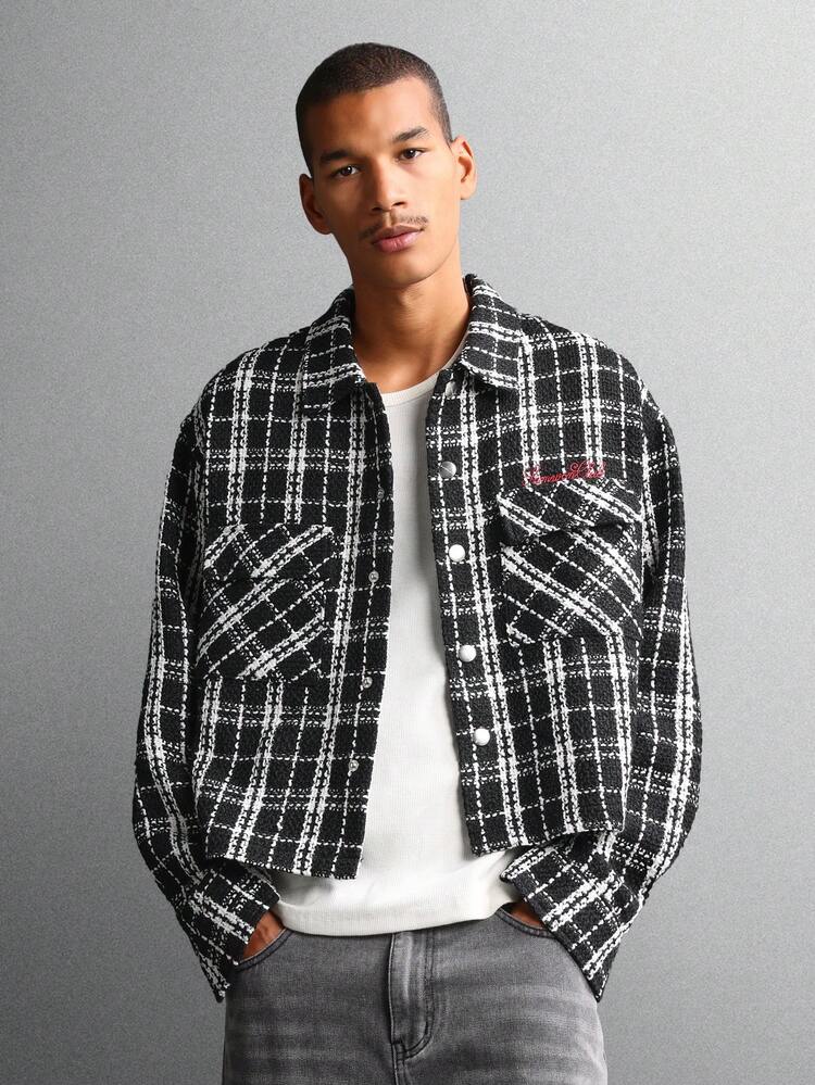 Giacca in tweed a quadri con bottoni sul davanti e tasche con patta