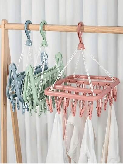 SHEIN 【节省空间】1个多功能衣架，专为节省空间和压缩而设计，包含32个夹子收纳架、可折叠衣架、多功能烘干机、塑料夹子、衣服和袜子夹子、家居必需品、旅行收纳。颜色和款式随机（PS：运输过程中部分夹子脱落属于正常现象，不影响产品质量，可重新安装使用）