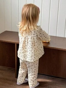 SHEIN Playful Pals 2 pezzi Set di maglietta a maniche lunghe con colletto a volant e stampa floreale e pantaloni per bambine, adatto per autunno/inverno, da indossare in casa o all'aperto - Albicocca - Visualizzare 2