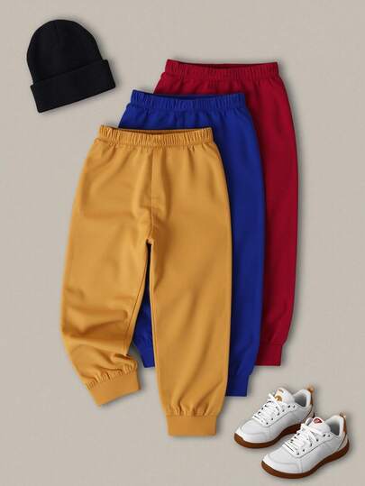 SHEIN Set de 3 pantalones de chándal de cintura elástica todo a juego para niño pequeño, pantalones casuales minimalistas de estilo urbano adecuados para deportes al aire libre y uso diario, otoño/invierno, amarillo, azul, rojo