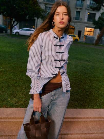 Nöista Striped Blouse With An Elegant Mandarin Collar, A Fitted Peplum Silhouette And Stylish Ruched Cuffs, Offering A Refined And Feminine Option For Women's Winter, Perfect For Formal Styling, Polished Everyday, Festive Summer Looks And Sophisticated Spring Ensembles.