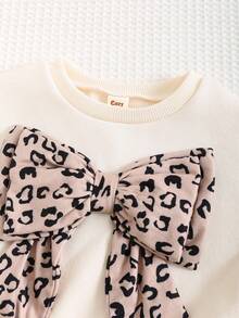 Cozy Pixies Set de 2 piezas: Sudadera de cuello redondo de manga larga con estampado de leopardo y lazo decorativo, y pantalones de cintura elástica de unicolor para niña. Conjunto de moda casual básica y versátil, cómodo para usar en interiores, exteriores, escuela, uso diario, deportes, fiestas, festivales, Halloween, Navidad y Año Nuevo en otoño/invierno. - Multicolor - Ver 6