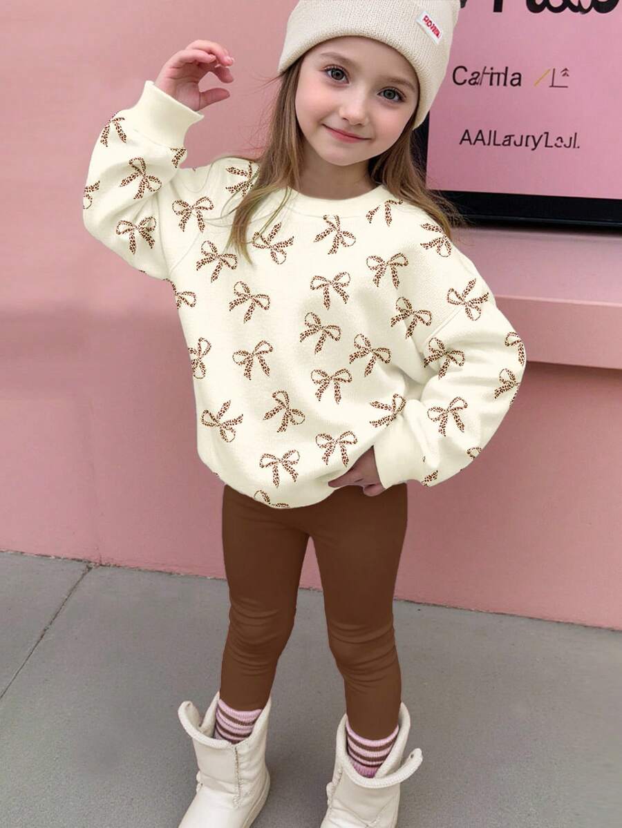 SHEIN 2 件套年轻女孩奶油黄和咖啡棕色可爱迷你豹纹蝴蝶结图案圆领长袖运动衫和紧身裤，秋冬装，轻松舒适，秋季多层穿着，时尚休闲装，儿童图案服装，返校，秋季服装，返校节