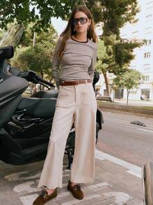 Nöista Cream Corduroy Wide-Leg Pants With High-Rise Fit, Front Patch Pockets, And A Straight Cropped Hem For A Relaxed Yet Polished Silhouette. Perfect For Fall And Winter Outfits - Pair With Knits, Blouses, Or Tailored Outerwear For Chic Everyday Style, City Strolls, Or Casual Gatherings.