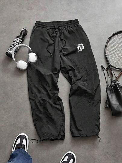 Manfinity Sport Corelite 男士字母印花抽绳腰带运动裤，舒适超轻，宽松版型，适合健身穿着。