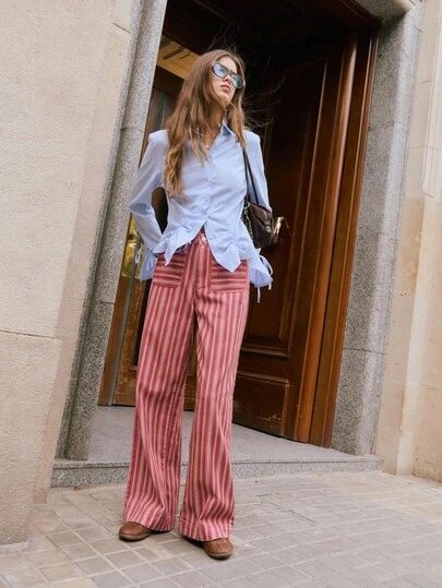 Nöista Wide-Leg Flared Striped Pants With A High-Rise Waist And Oversized Front Pockets, Offering A Chic And Elegant Silhouette Perfect For Women's Winter Outfits, Refined Casual Styling, Polished Everyday Looks, Festive Christmas Dressing And Modern New Year Ensembles.