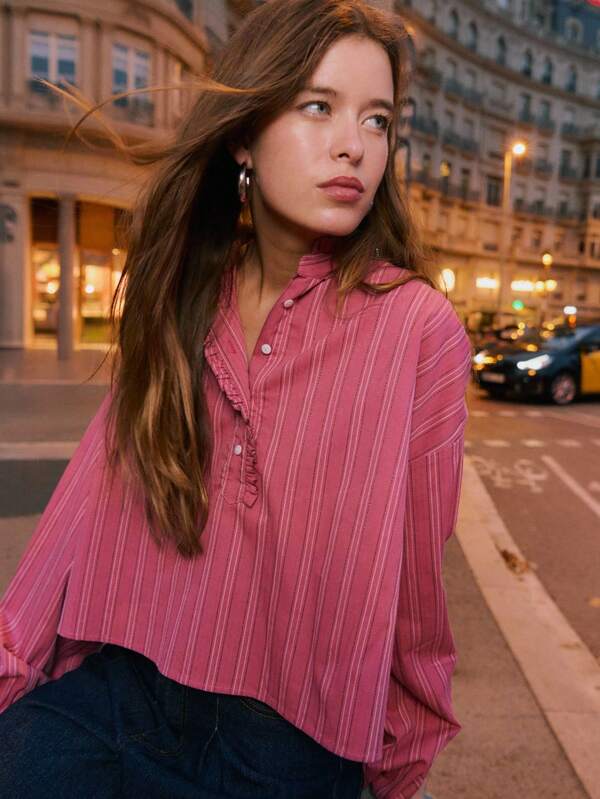 Nöista Striped High-Neck Blouse With Ruffle Detailing And Front Button Placket, Featuring A Pleated Front And Full Balloon Sleeves That Create A Romantic And Elegant Silhouette Perfect For Women's Winter, Polished Everyday Looks, Festive Christmas Styling And Refined New Year Ensembles.