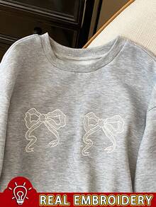 SHEIN Sudadera de cuello redondo con mangas raglán, bordado de lazo de encaje para mujer