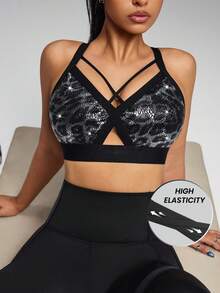 Innovista Áo ngực thể thao thời trang, gợi cảm và co giãn tốt, lấp lánh, thích hợp cho phòng tập, thư giãn và đi chơi tối. Chất liệu cao cấp mềm mại với miếng đệm có thể tháo rời và dây đeo điều chỉnh được. Kiểu dáng thoải mái, hỗ trợ vừa phải. Trang phục tập luyện đa năng - sẵn sàng cho hoạt động thể thao với độ nâng đỡ chắc chắn và thoáng khí. Áo tập luyện ánh kim lấp lánh họa tiết động vật, trang phục thể thao hàng ngày, tập Pilates, trang phục năng động mùa thu. Thiết kế lưng chéo tiện dụng cho tập luyện. - màu đen - Xem 6
