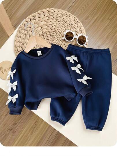 女婴海军蓝蝴蝶结长袖连帽衫和松紧腰裤套装，秋冬