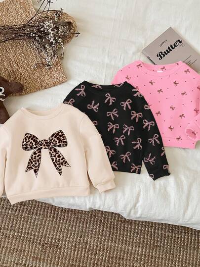 3件套女婴休闲宽松圆领卫衣，米白色、黑色、米粉色，复古豹纹蝴蝶结、迷你波点蝴蝶结图案，柔软舒适，适合秋冬季穿着。