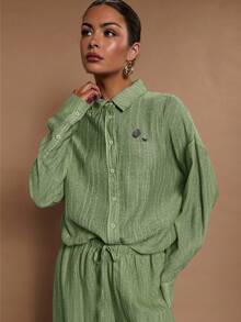 COSMINA Camisa casual de manga larga con botones delanteros de unicolor y corte holgado para mujer