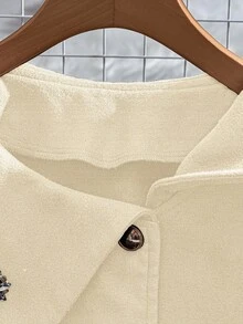 GlowEve Élégant manteau pour femme avec décoration de bouton métallique floral et grand revers