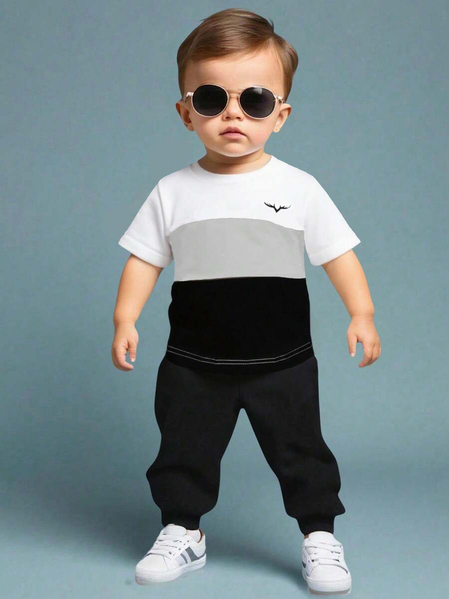 SHEIN 男婴针织短袖上衣，饰有简洁的小图案。采用绿色、棕色和杏色的多色拼接。适合夏季穿着，可作为运动装，适合度假、外出、上学或居家穿着。这是一款百搭的夏季基本款，也是婴儿夏季服装。幼儿服装，男女通用夏季婴儿服装。 - 彩色 - 查看 1