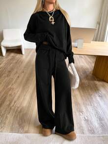 CovetEZ Women's Black Knitwear Sweater Co-Ord With Asymmetrical Neck Long Drop Shoulder Sleeves And Regular Length Plain Rib-Knit Pants Casual Loungewear Set Black 2 Piece Set Black Pants Suit Women Two Piece Set Women Comfy Two Piece Lounge Set Comfortable Two Piece Set,Fall,Fall Clothes For Women - Black - View 3