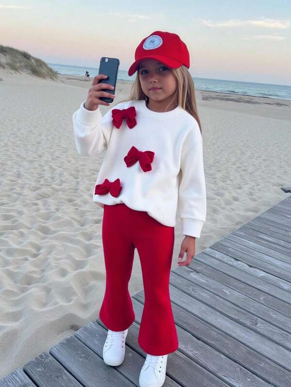 Set de 2 piezas de top de manga larga con cuello redondo y decoración de mariposa tejida, y pantalones rojos acampanados para niñas, para primavera/otoño